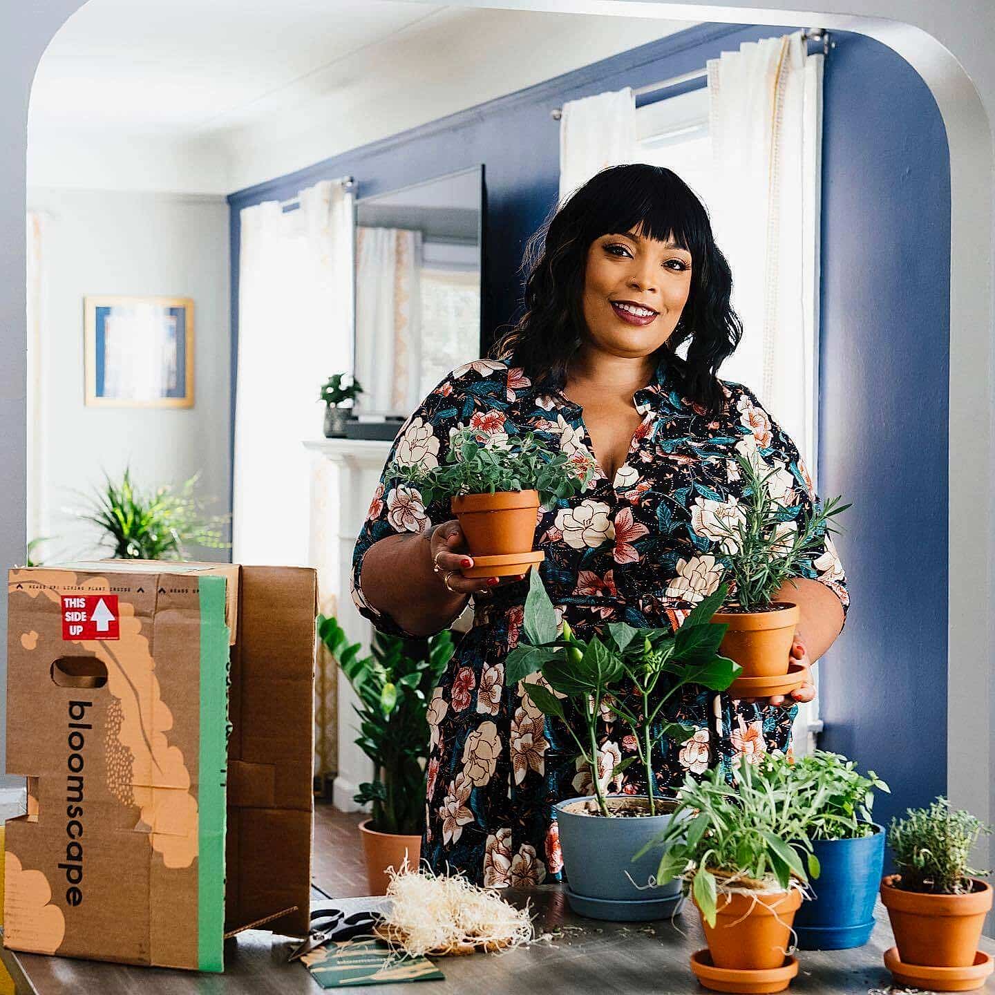 Food blogger Angela Davis unboxes a Bloomscape Aromatic Herb collection in her home kitchen