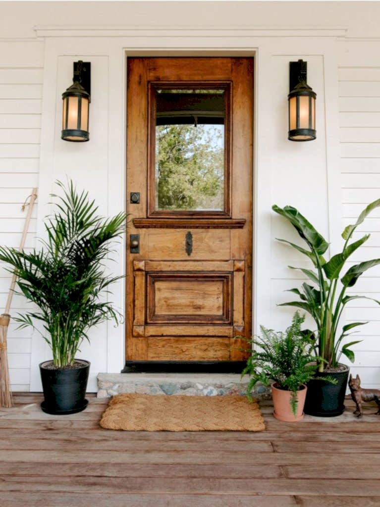 Shop Large and XL plants. Bird of Paradise and Palm plants on either side of front door.
